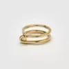 Anillo Admiral Row con doble nudo dorado