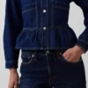 Blusa ajustada de denim con peplum