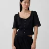 Blusa con peplum y ribete de encaje