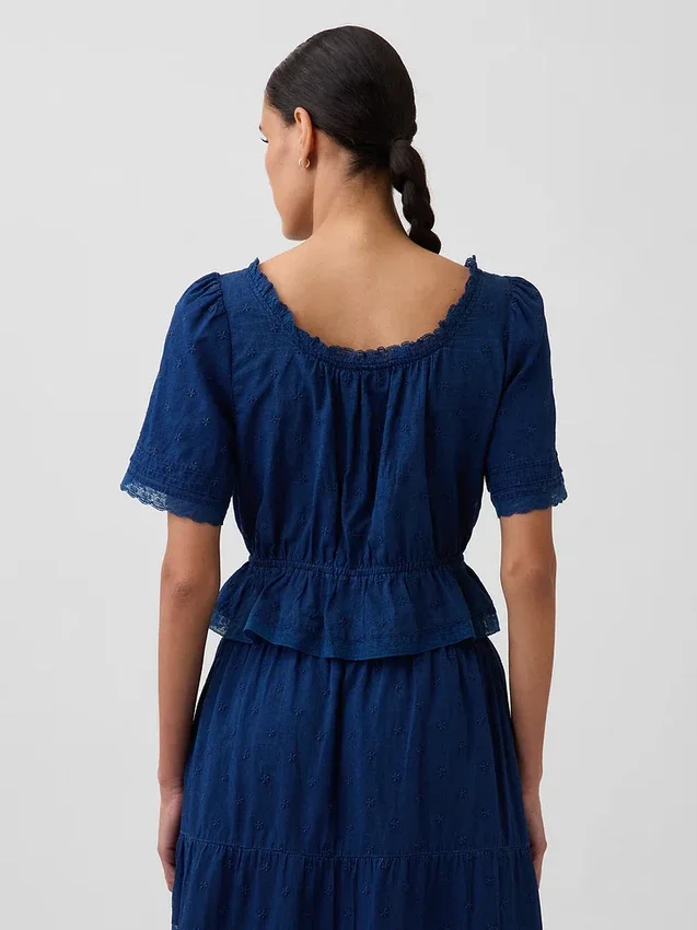 Blusa con peplum y ribete de encaje