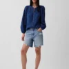 Blusa con pliegues y ribete de encaje