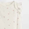 Body de algodón orgánico con mangas ondeadas de la colección «Baby First Favorites»