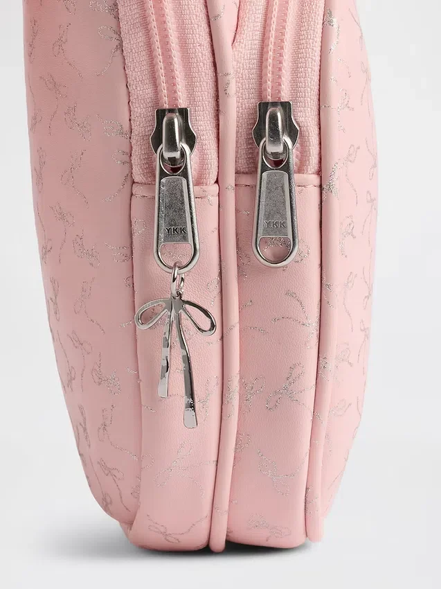 Bolso bandolera infantil con logotipo de lazo