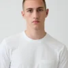 Camiseta con bolsillo de algodón orgánico para adulto
