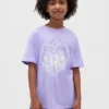 Camiseta infantil oversize tipo túnica con estampado