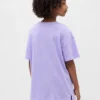 Camiseta infantil oversize tipo túnica con estampado