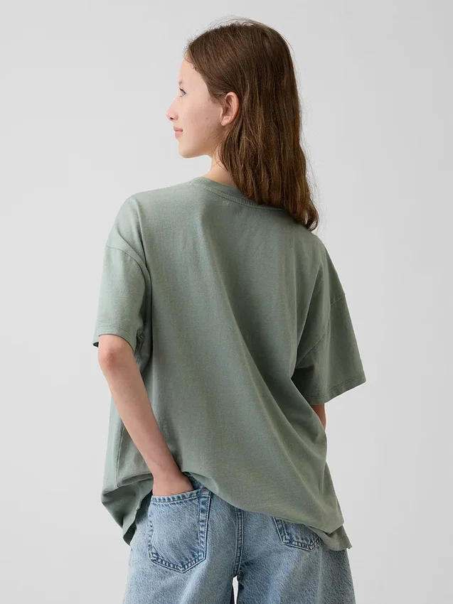 Camiseta infantil oversize tipo túnica con estampado