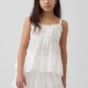 Camiseta sin mangas infantil con volantes y ojales