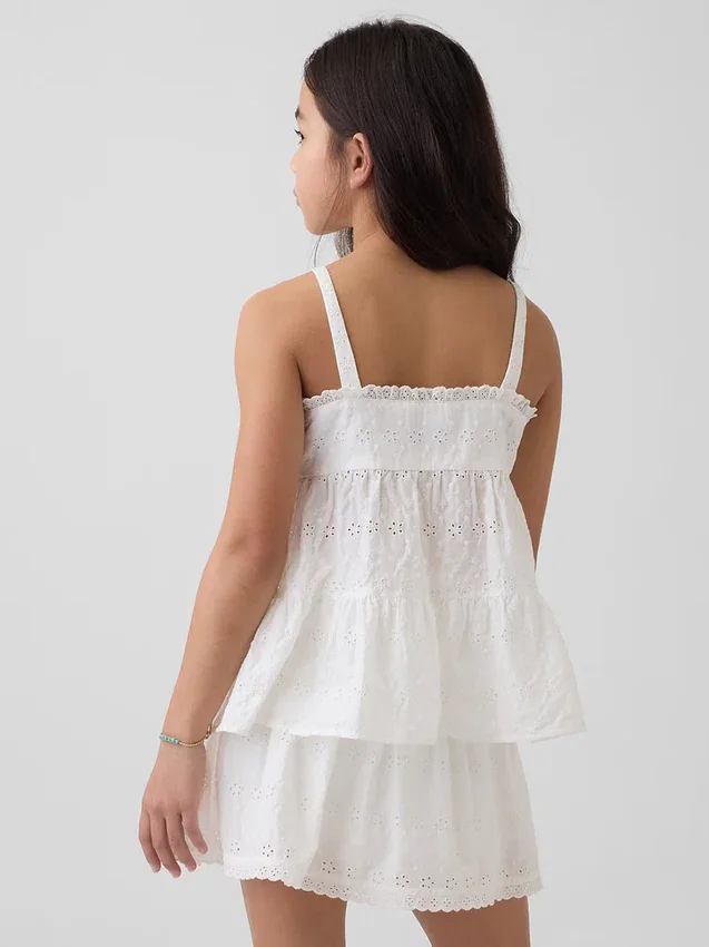 Camiseta sin mangas infantil con volantes y ojales