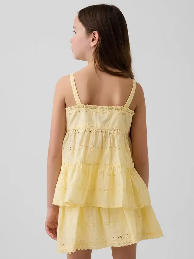 Camiseta sin mangas infantil con volantes y ojales