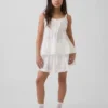 Camiseta sin mangas infantil con volantes y ojales