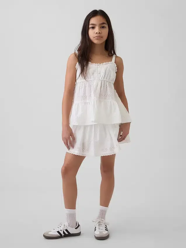 Camiseta sin mangas infantil con volantes y ojales