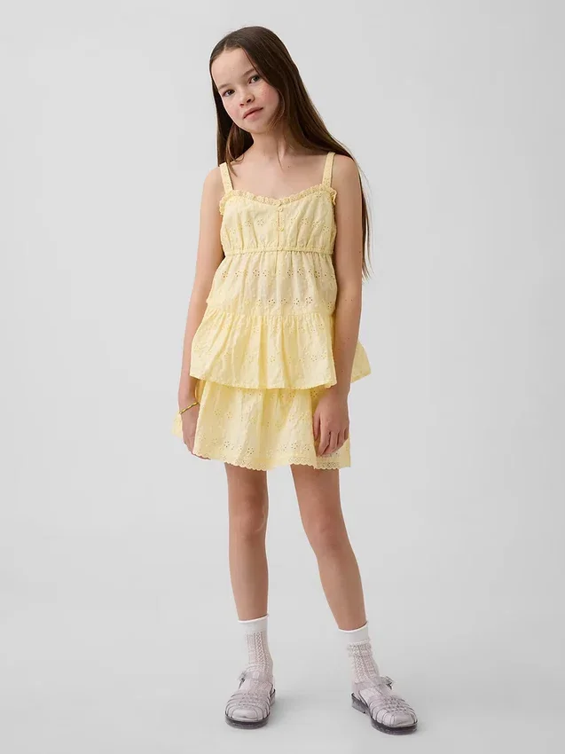 Camiseta sin mangas infantil con volantes y ojales