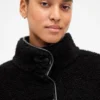 Chaqueta de sherpa reciclado con ribetes de cuero vegano