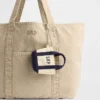 Colgante para bolso de tela con logotipo