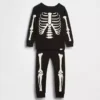 Conjunto de pijama de algodón orgánico cepillado para niños y bebés con estampado de esqueleto que brilla en la oscuridad