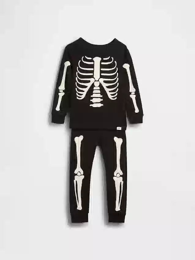 Conjunto de pijama de algodón orgánico cepillado para niños y bebés con estampado de esqueleto que brilla en la oscuridad