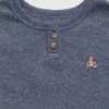 Conjunto de pijama de algodón orgánico jaspeado con cuello Henley para bebés y niños