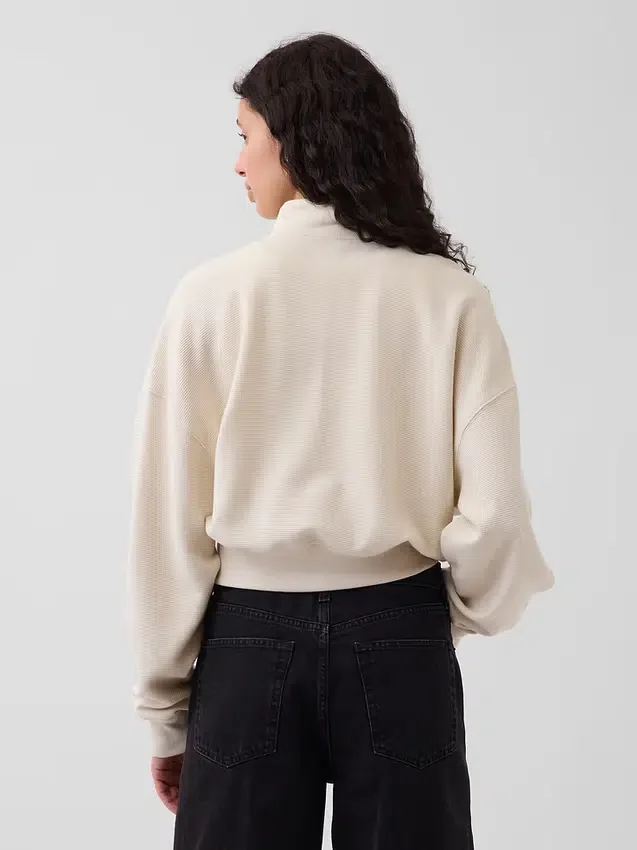 Jersey oversize de algodón texturizado con media cremallera