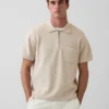Jersey polo oversize con cremallera de un cuarto y bolsillo