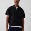 Jersey polo oversize con cremallera de un cuarto y bolsillo