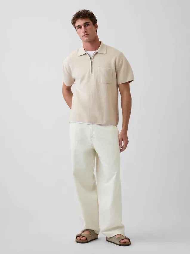 Jersey polo oversize con cremallera de un cuarto y bolsillo