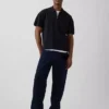 Jersey polo oversize con cremallera de un cuarto y bolsillo