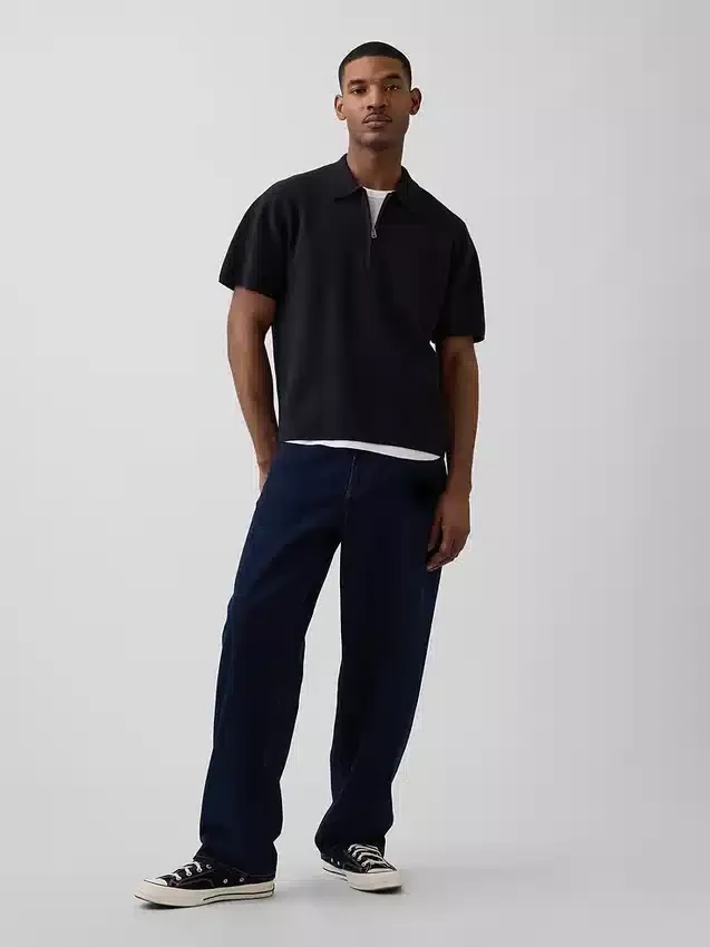 Jersey polo oversize con cremallera de un cuarto y bolsillo
