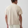 Jersey polo oversize con cremallera de un cuarto y bolsillo