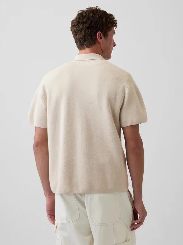 Jersey polo oversize con cremallera de un cuarto y bolsillo