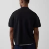 Jersey polo oversize con cremallera de un cuarto y bolsillo