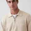 Jersey polo oversize con cremallera de un cuarto y bolsillo