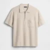 Jersey polo oversize con cremallera de un cuarto y bolsillo