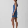 Minivestido vaquero con cuello barco y espalda abierta