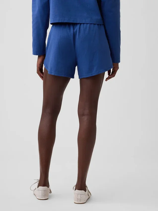 Pantalones cortos de punto con bajo en forma de delfín de 3"