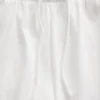 Pantalones cortos de punto con bajo en forma de delfín de 3"