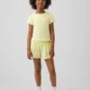 Pantalones cortos de running de secado rápido con bajo de mariposa para niños
