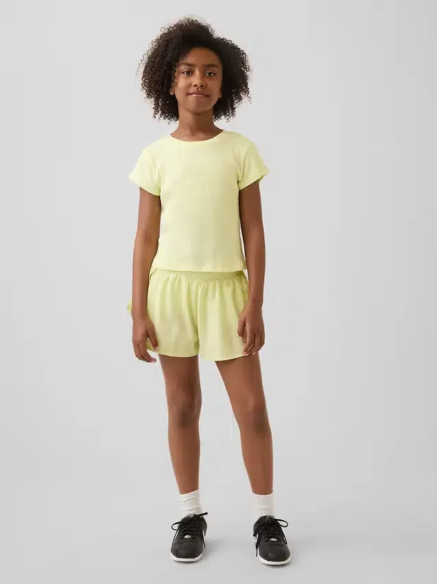 Pantalones cortos de running de secado rápido con bajo de mariposa para niños