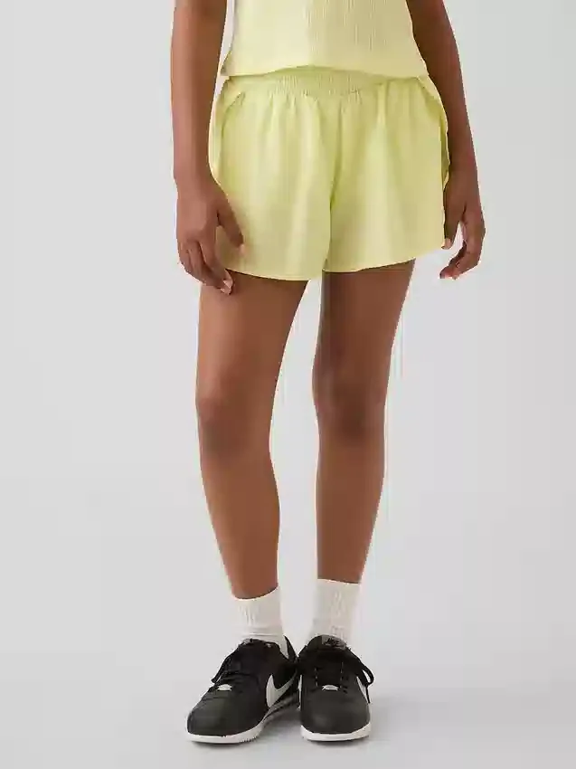 Pantalones cortos de running de secado rápido con bajo de mariposa para niños