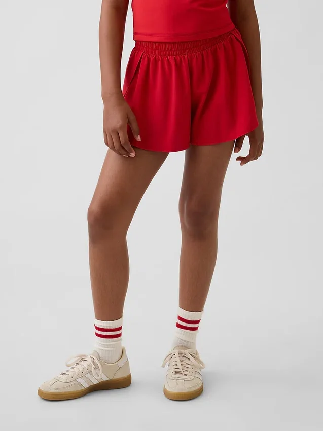 Pantalones cortos de running de secado rápido con bajo de mariposa para niños