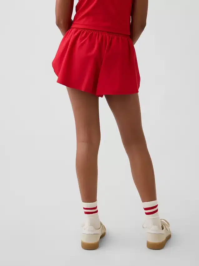 Pantalones cortos de running de secado rápido con bajo de mariposa para niños