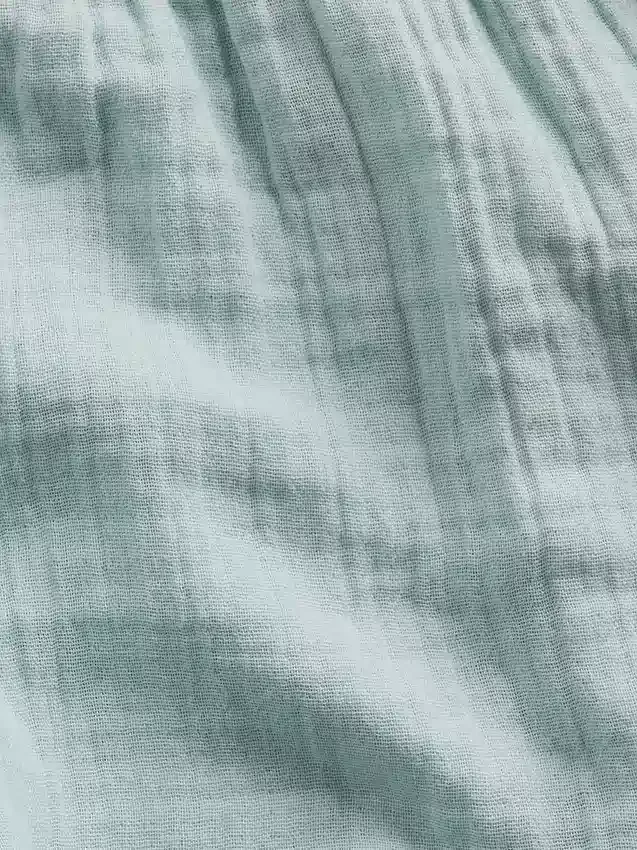 Pantalones cortos infantiles de gasa de algodón con bajo en forma de mariposa