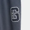 Pantalones de chándal de adulto de tejido grueso y corte holgado con logotipo