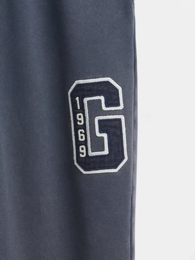 Pantalones de chándal de adulto de tejido grueso y corte holgado con logotipo
