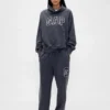 Pantalones de chándal de adulto de tejido grueso y corte holgado con logotipo