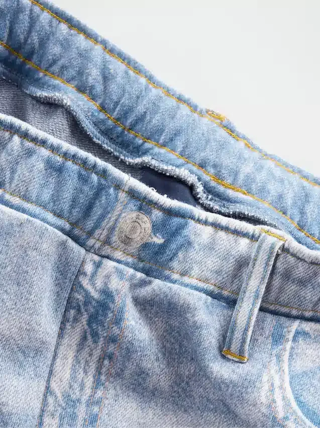 Pantalones de chándal holgados estampados con diseño de vaqueros