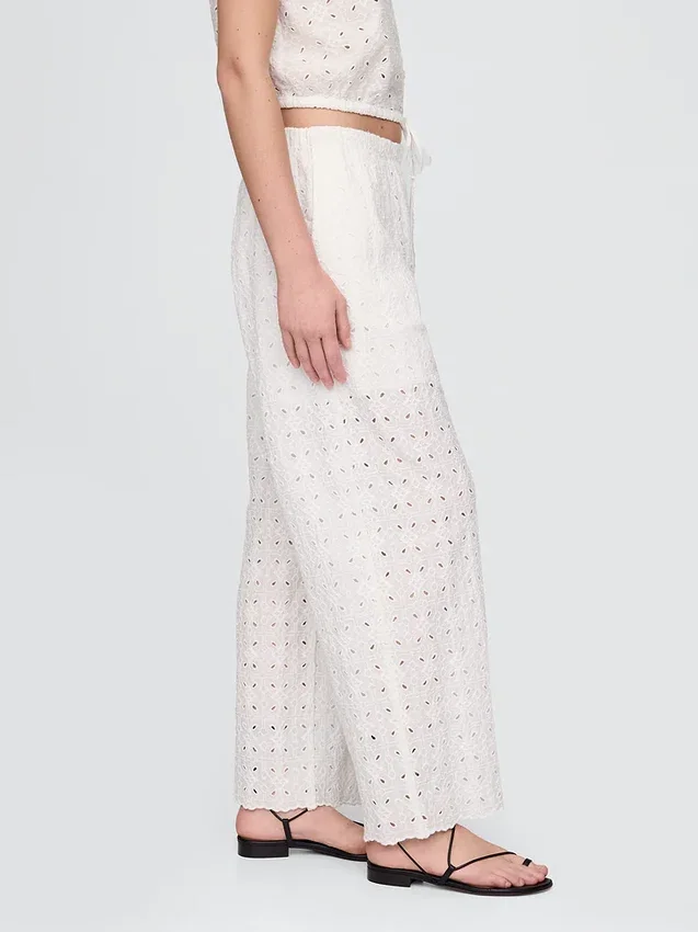 Pantalones de talle medio con ojales y corte ancho