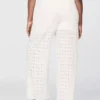 Pantalones de talle medio con ojales y corte ancho