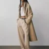 Pantalones de talle medio de sarga con corte acampanado