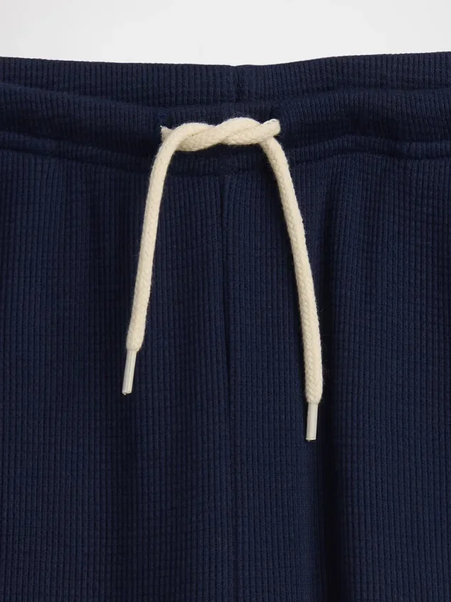 Pantalones infantiles holgados de punto waffle con pernera ancha